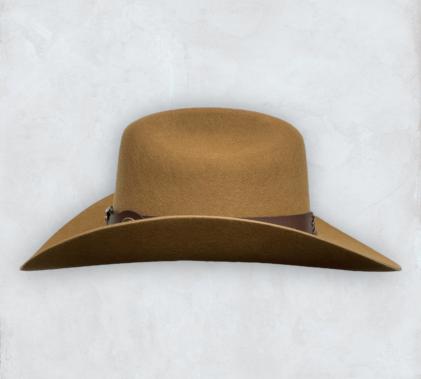 Brown cowboy hat made of high-quality felt with leather band and metal bull head