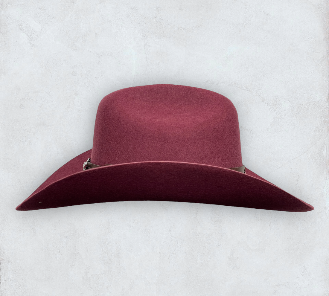 Red cowboy hat made of high-quality felt with leather band and metal bull head