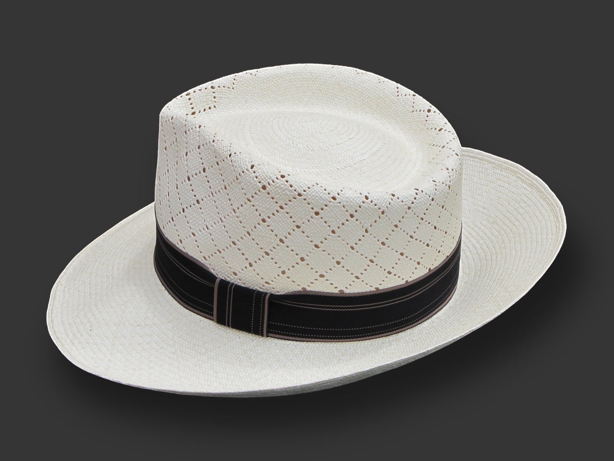 TomHats Havana Panama hat made of light-colored straw with a ventilated diamond pattern and a black hatband.