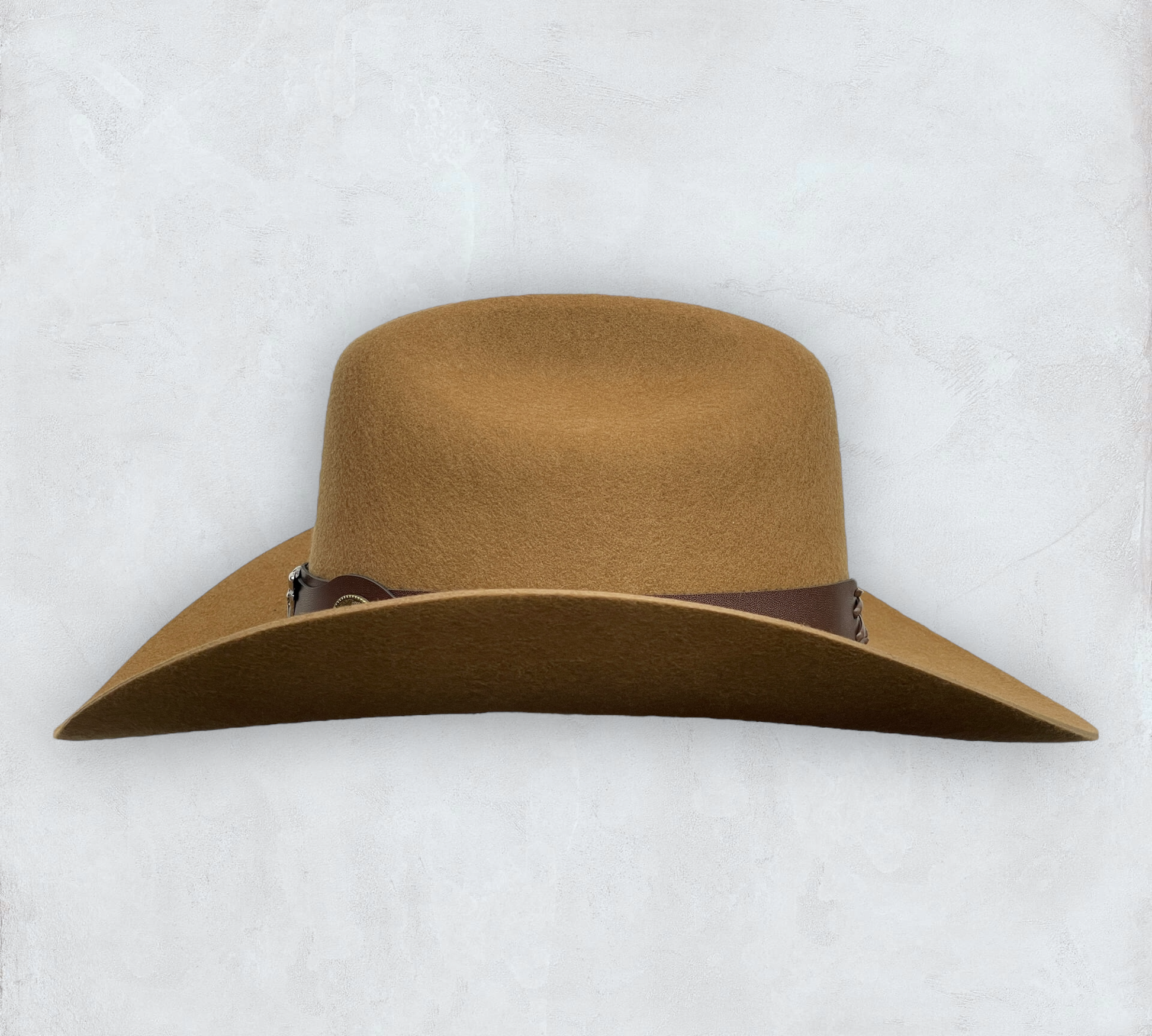 Brown cowboy hat made of high-quality felt with leather band and metal bull head