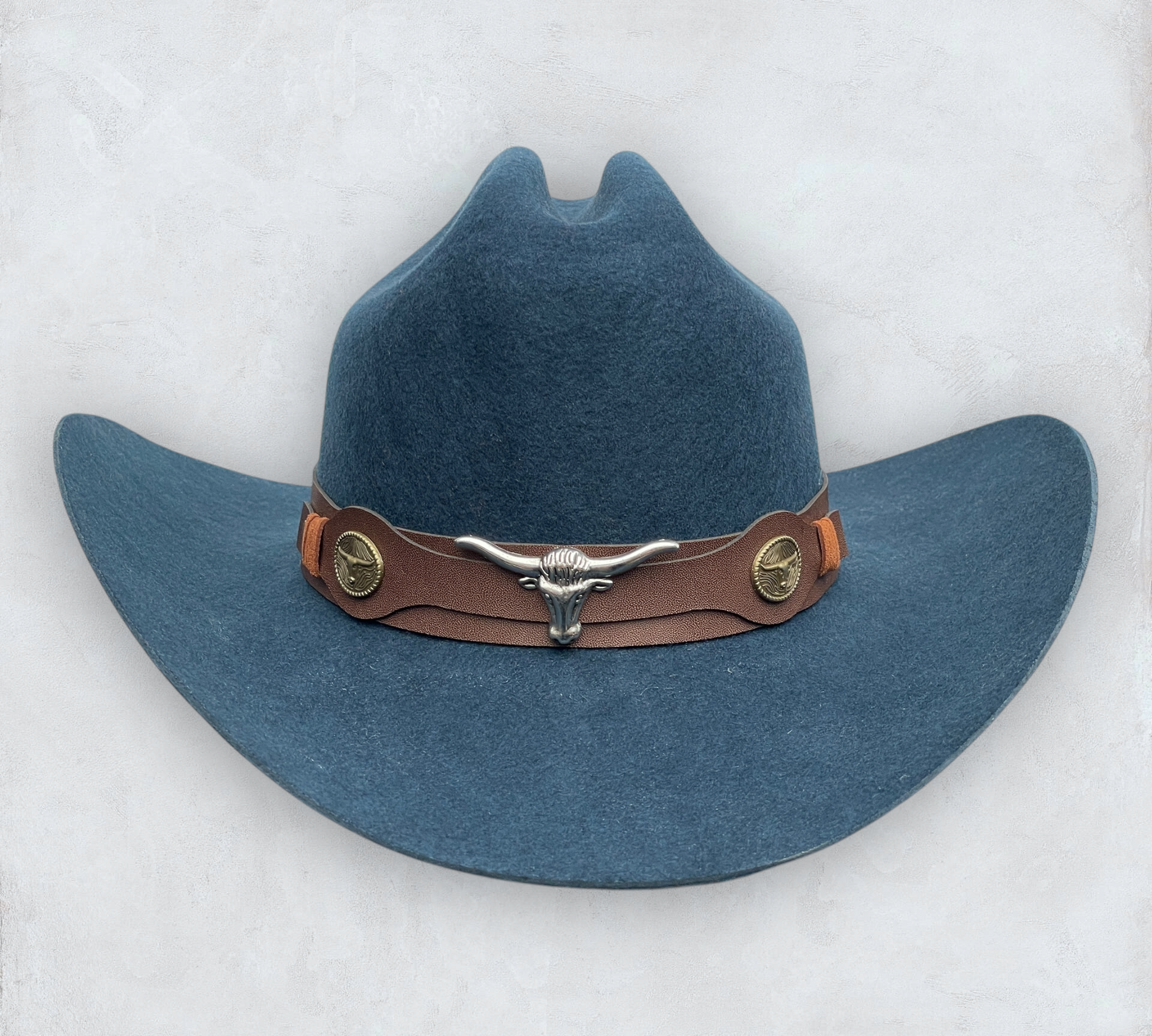 Blue cowboy hat made of high-quality felt with leather band and metal bull head