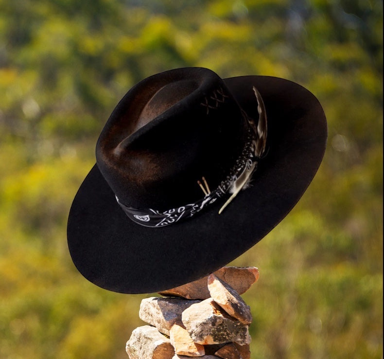 TomHats Havana black wool felt boater hat featuring a bandana band, feathers, and handcrafted stone-stack details.