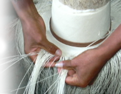 Hat maker is working on a Panama hat