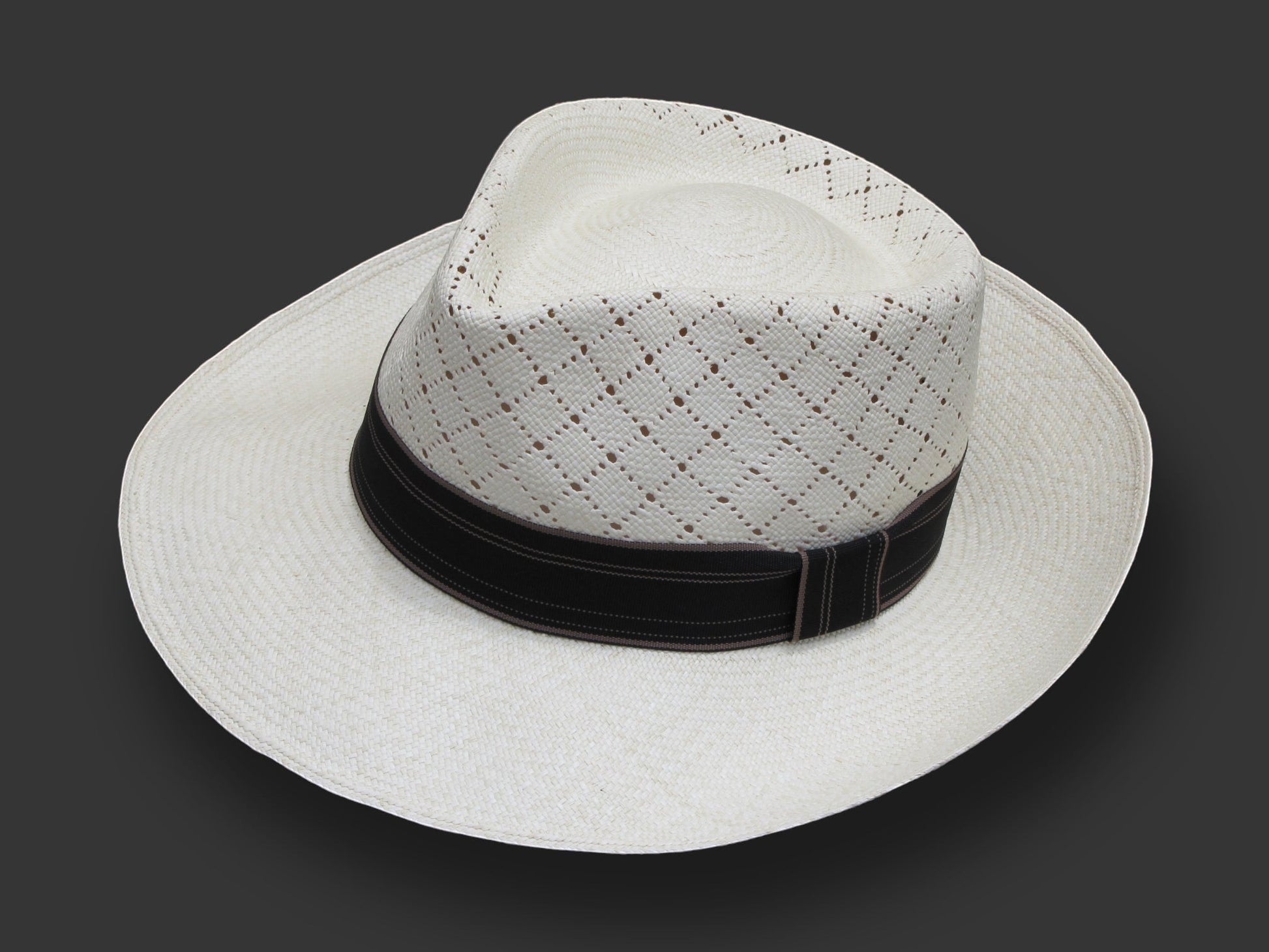 TomHats Havana Panama hat made of light-colored straw with a ventilated diamond pattern and a black hatband.
